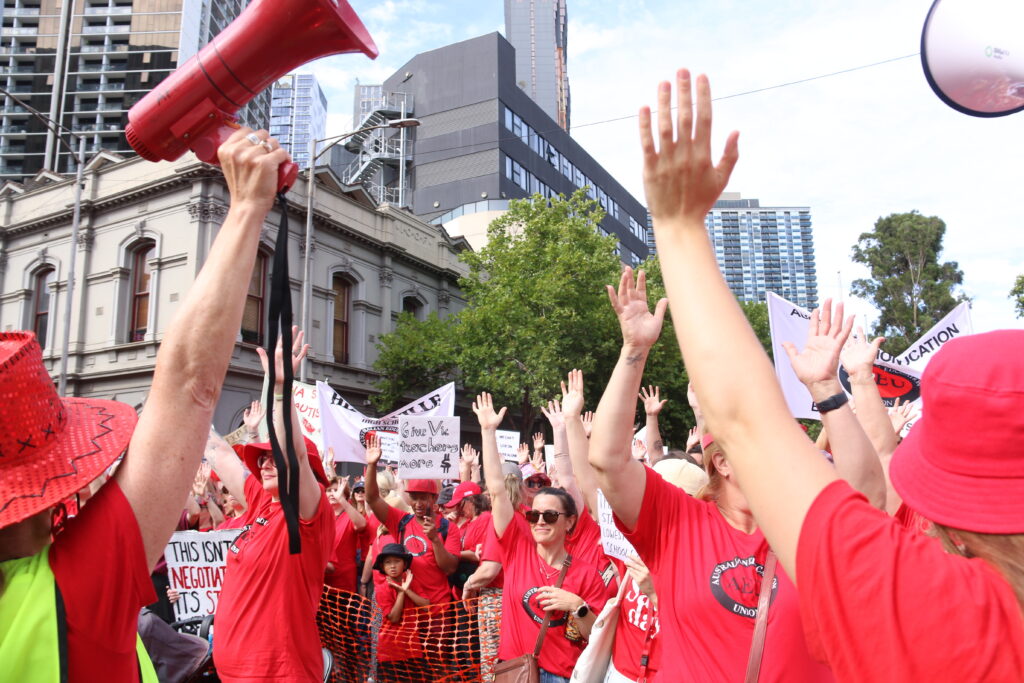 Workers cheer at a union rally